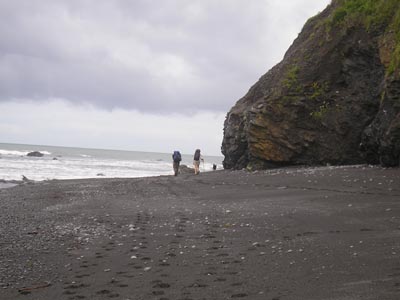 a wide beach provides easy hiking between water and cliffs.