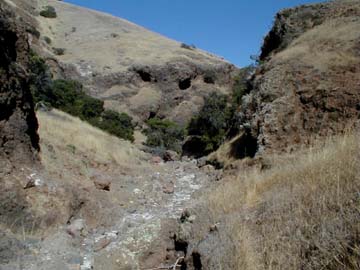follow the stream bed through the canyon.