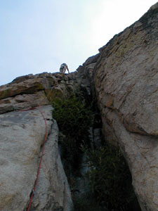 Chris leads the left edge of the chimney, first pitch, obelisk
