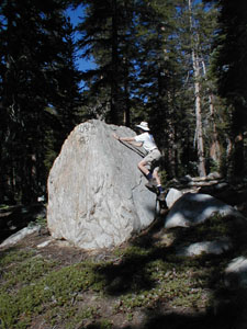 Chris Hibbert climbs a boulder near Geraldine lakes.